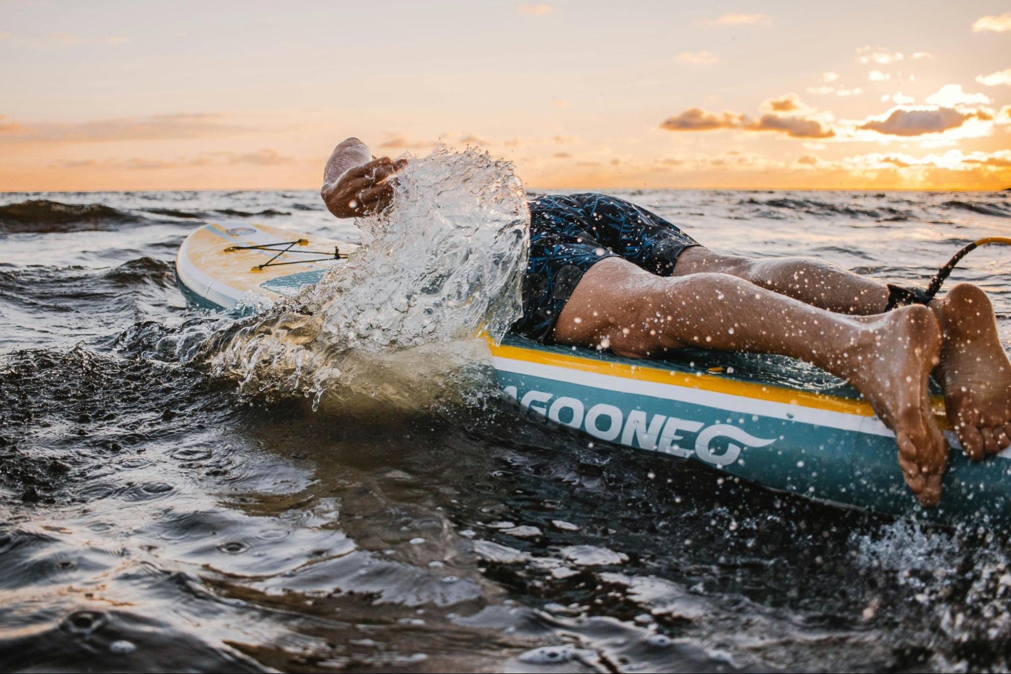 Surfer paddling on a surfboard